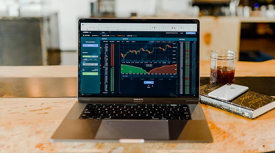 Laptop with financial charts