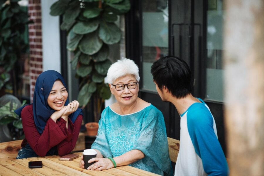 A senior citizen chatting with the next generation